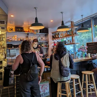 a group of people sitting at a bar