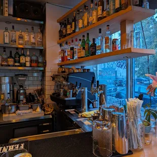 a view of a bar with bottles of alcohol