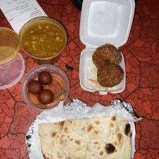 Naan, gulab jamun, vegetable cutlets, and Chana masala.