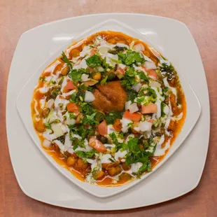 a plate of food on a wooden table