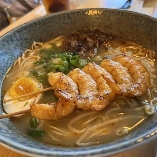 a bowl of ramen and shrimp