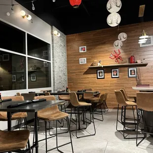 a dining area with tables and chairs