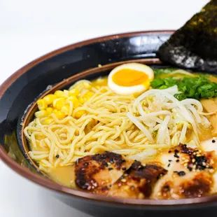 a bowl of ramen noodles with a boiled egg