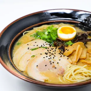 a bowl of ramen with a soft boiled egg