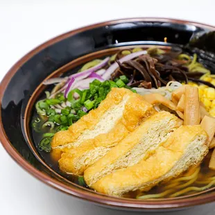 a bowl of ramen and vegetables