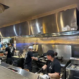 View of the kitchen from bar seating