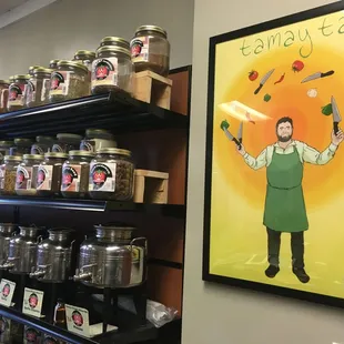 a man in a green apron holding a knife