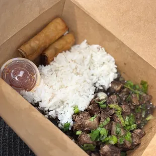 Dinuguan plate with lumpia and white rice