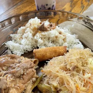 Chicken adobo, pancit, egg rolls and rice