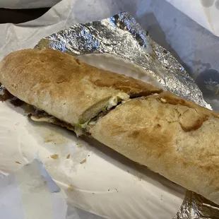 Cheese steak. Chicken cheese steak and fries.