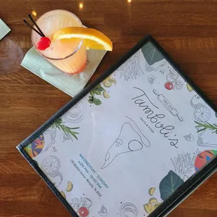 Little tequila sunrise with their menu