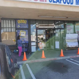 Market entrance with plenty of parking and reserved spots for catering pickup.