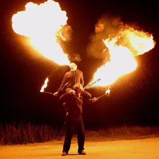 Fire breathing piggy back ride.