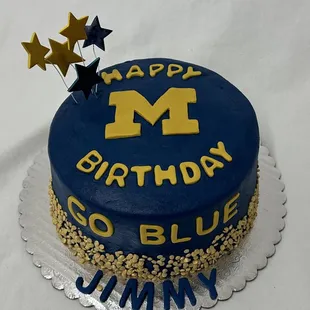 6 inch cookies and cream layer cake with buttercream frosting and fondant letters.