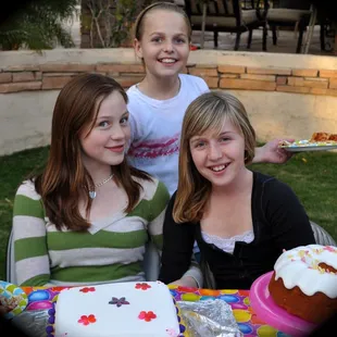 two girls and a cake