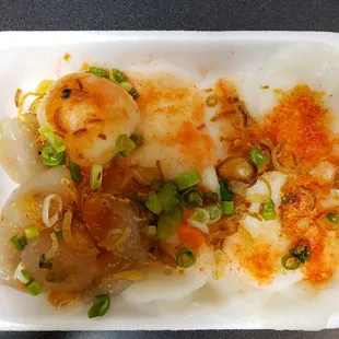 scallops and scallops in a styrofoam container