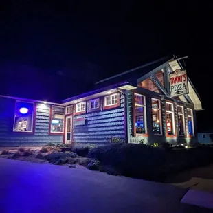 the exterior of the restaurant at night