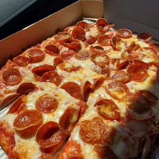 a pepperoni pizza in a box