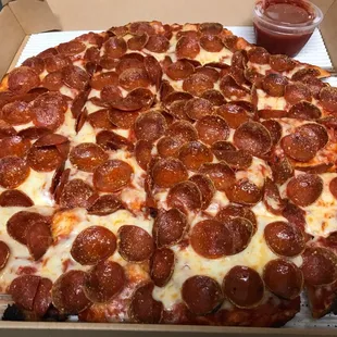 a pepperoni pizza in a box