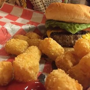 a hamburger and tater tots