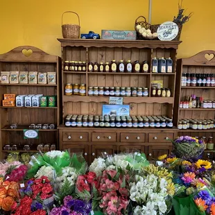 a variety of flowers and jars
