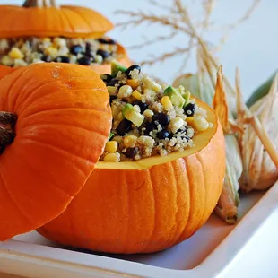 two pumpkins stuffed with corn and beans