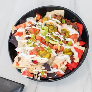 Enjoy the food we make with love, ice cold beers and cocktails while watching all sports games indoors or on our patio!