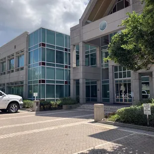 a white truck parked in front of a building