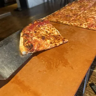 I'm holding the "corrected" new traditional crust pizza.