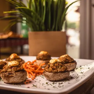 a plate of stuffed mushrooms