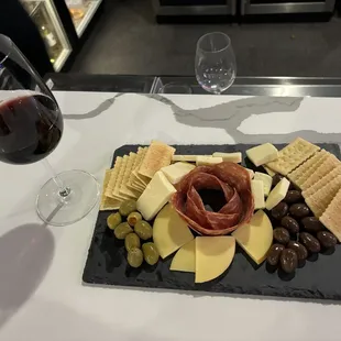 This delicious charcuterie was made by Alyssa, beautiful. The ambience is always good, they have life music, and good wine