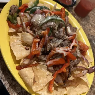 Fajita Nachos with steak - love all the fresh veggies!