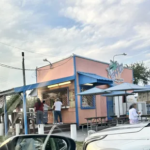 people standing outside a restaurant