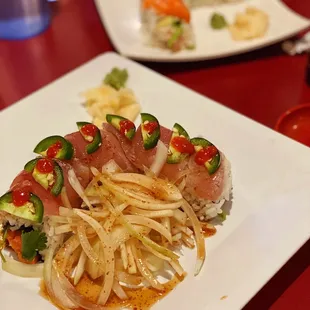 two plates of food on a red table