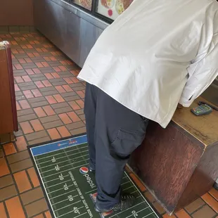 a man leaning over a table