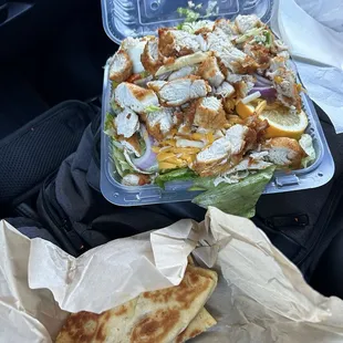 Large crispy salad. Extra pita bread comes with a large.  So much food crammed in, it&apos;s hard to eat from the container.