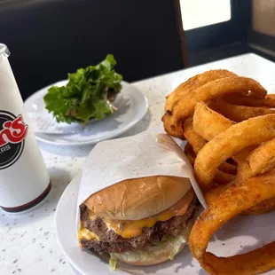 a hamburger and onion rings