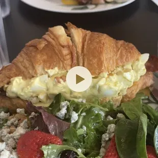 Tams quiche and home potatoes. Egg salad on croissant and strawberry salad. Absolutely delicious!