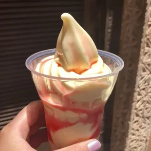 Simba Sunset: pineapple dole whip with a watermelon, strawberry, and coconut syrup