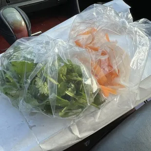 carrots and broccoli wrapped in plastic