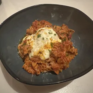 The radiatorre pasta with red gravy, Calabrian chili and burrata! Delicious