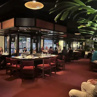 a restaurant with people sitting at tables