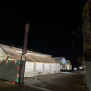 a white tent with christmas lights