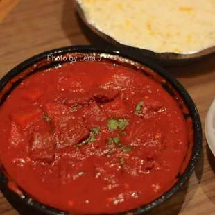 Lamb Vindaloo ($16.95) Hot and spicy recipe of boneless lamb cubes with potatoes in a tangy sauce.