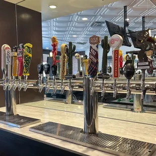a row of beer taps