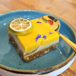 a slice of lemon cake on a plate