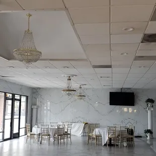 a large room with tables and chairs