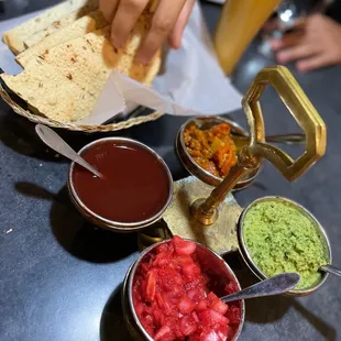 a person grabbing a tortilla