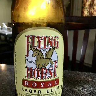 a bottle of flying horse royal lager beer