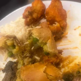 Flaky samosas, tandoori fish, and beef with mushroom over rice.